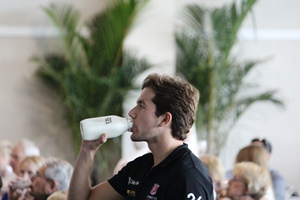The Indy 500's Fastest Rookie Carlos Munoz takes a drink of milk during this week's Fastest Rookie Luncheon.