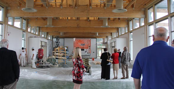 Lt. Governor Sue Ellspermann (solid red) gets a sneak peak of Indiana Soybean's Glass Barn that will open at this year's Indiana State Fair.