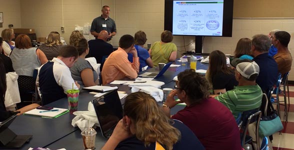 DuPont Pioneer Agronomist Kyle Poling talking with high school teachers at the 2014 Bioscience Academy