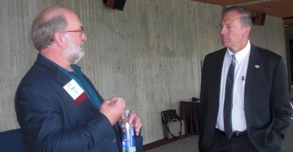 Iowa Farm Bureau Federation president Craig Hill (right) visits with futurist Tom Frey of the DaVinci Institute at the IFBF Economic Summit in Ames.