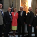 Holcomb signs historic road funding bill into law