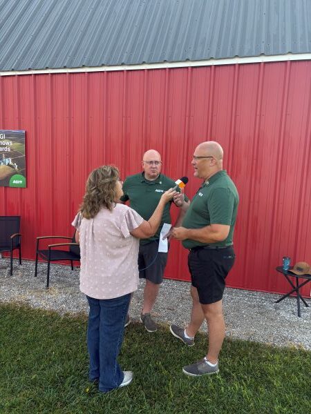 Cyndi talks with Jason Jones and Kent Woods with AGI